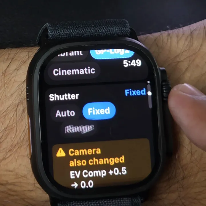 Apple Watch with Shutter set to Fixed and the banner EV Comp +0.5 to 0.0